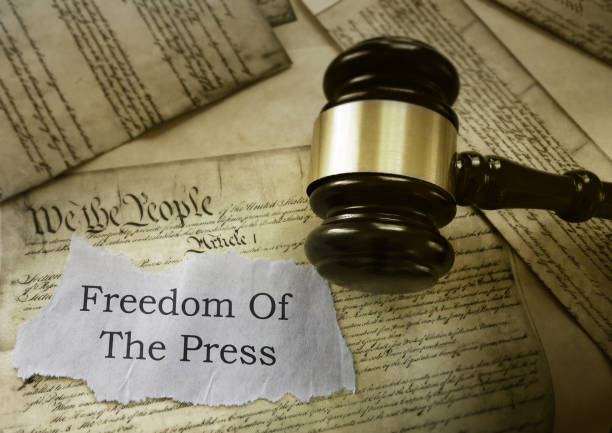 Freedom of the Press news headline on a copy of the US Constitution